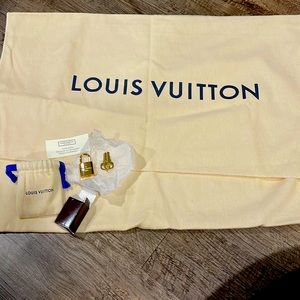 New Louis Vuitton Hand bag protector with lock and keys.